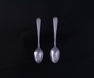 A pretty pair of Victorian Old English bright cut pattern sterling silver teaspoons