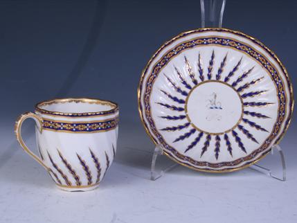 A Derby armorial porcelain coffee cup and saucer