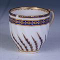 A Derby armorial porcelain coffee cup and saucer