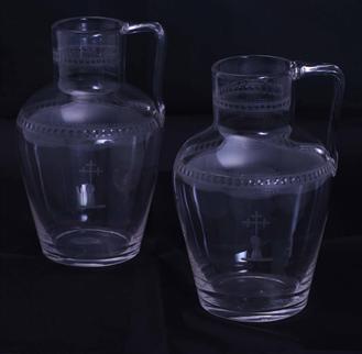 Pair armorial glass water jugs