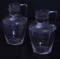 Pair armorial glass water jugs