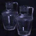 Pair armorial glass water jugs