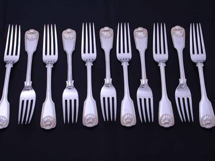 Set of eleven William IV fiddle, thread and shell pattern sterling silver table forks