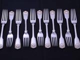 Set of eleven William IV fiddle, thread and shell pattern sterling silver table forks