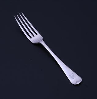 An Edwardian sterling silver Hanoverian pattern dessert fork