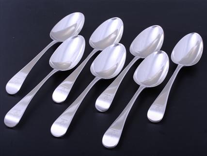 A set of seven Old English pattern sterling silver table spoons