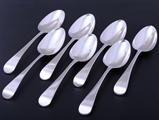 A set of seven Old English pattern sterling silver table spoons