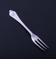 A sterling silver three pronged fork