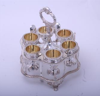 A fine Regency sterling silver egg cruet and frame