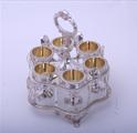 A fine Regency sterling silver egg cruet and frame