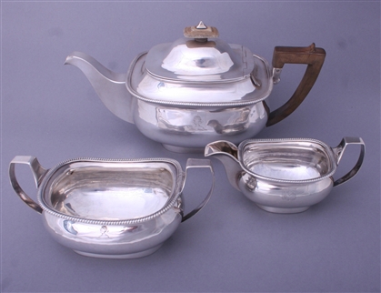 A George III three piece sterling silver tea set