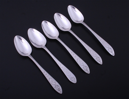 A matched set of five Irish Georgian Old English pointed bright-cut engraved sterling silver teaspoons