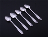 A matched set of five Irish Georgian Old English pointed bright-cut engraved sterling silver teaspoons