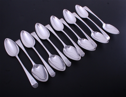 A fine set of 12 George III Old English pattern sterling silver table spoons