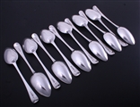 A fine set of 12 George III Old English pattern sterling silver table spoons