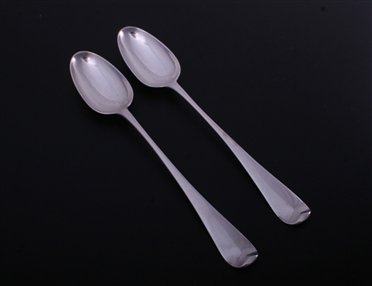 A pair of George II Hanoverian pattern sterling silver basting spoons