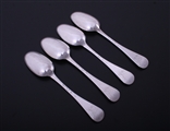 A set of four Hanoverian pattern sterling silver dessert spoons