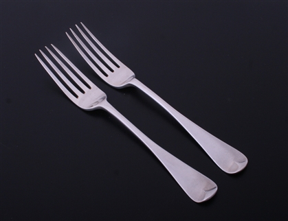 A pair of Victorian Old English pattern sterling silver table forks