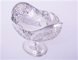 An impressive set of three Edwardian sterling silver fruit baskets