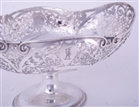 An impressive set of three Edwardian sterling silver fruit baskets