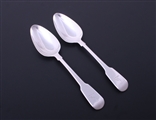 A pair of George III fiddle pattern sterling silver dessert spoons