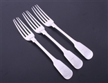 A set of three George IV fiddle pattern sterling silver table forks