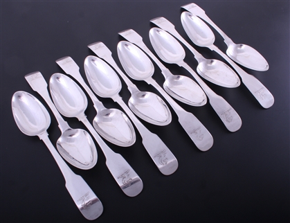 A set of twelve Irish George III fiddle pattern sterling silver table spoons