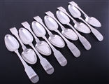 A set of twelve Irish George III fiddle pattern sterling silver table spoons