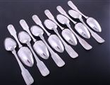 A set of twelve Irish George III fiddle pattern sterling silver table spoons