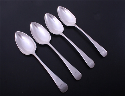 A set of four George III Old English pattern sterling silver table spoons