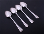 A set of four George III Old English pattern sterling silver table spoons