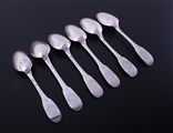 A matched set of six 18th century French provincial fiddle pattern armorial silver table spoons