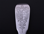 An 18th century French fiddle pattern provincial armorial silver table fork and spoon