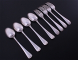 A set of eight Scottish Edwardian Old English pattern sterling silver dessert spoons and forks