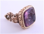 A magnificent and large gold and amethyst intaglio fob seal