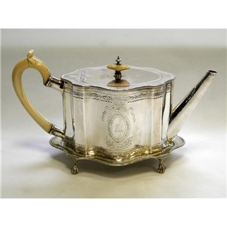 A pretty Victorian sterling silver teapot and stand