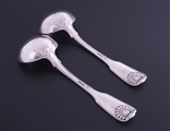 A pair of George IV sterling silver fiddle thread and shell sauce ladles