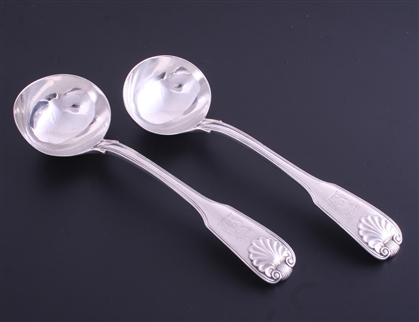 A pair of George IV sterling silver fiddle thread and shell sauce ladles