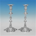 Pair of cast silver candlesticks